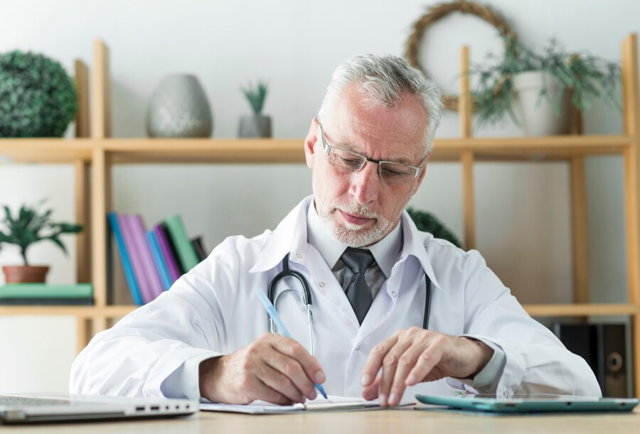 elderly doctor writing prescription 23 2147896131 Dr Ben Azouz Services